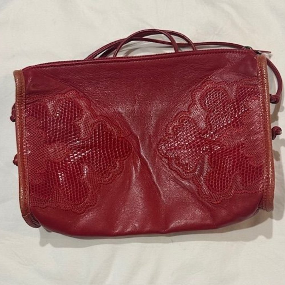 Red Carlos Falchi clutch bog with leather straps